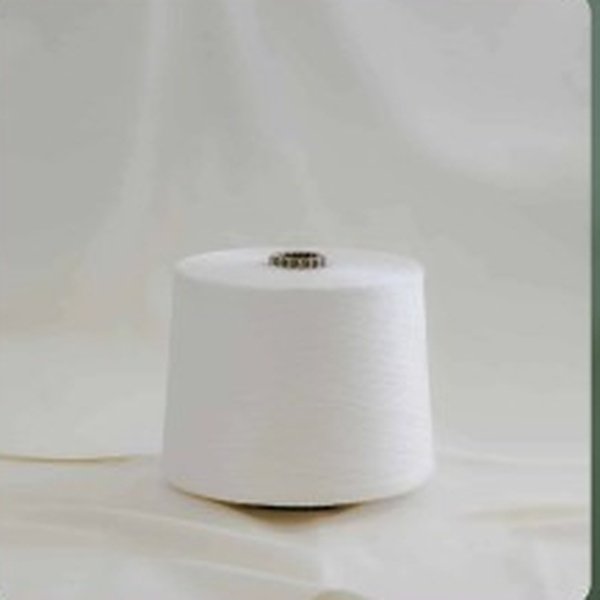 Spool of technical yarn on draped fabric